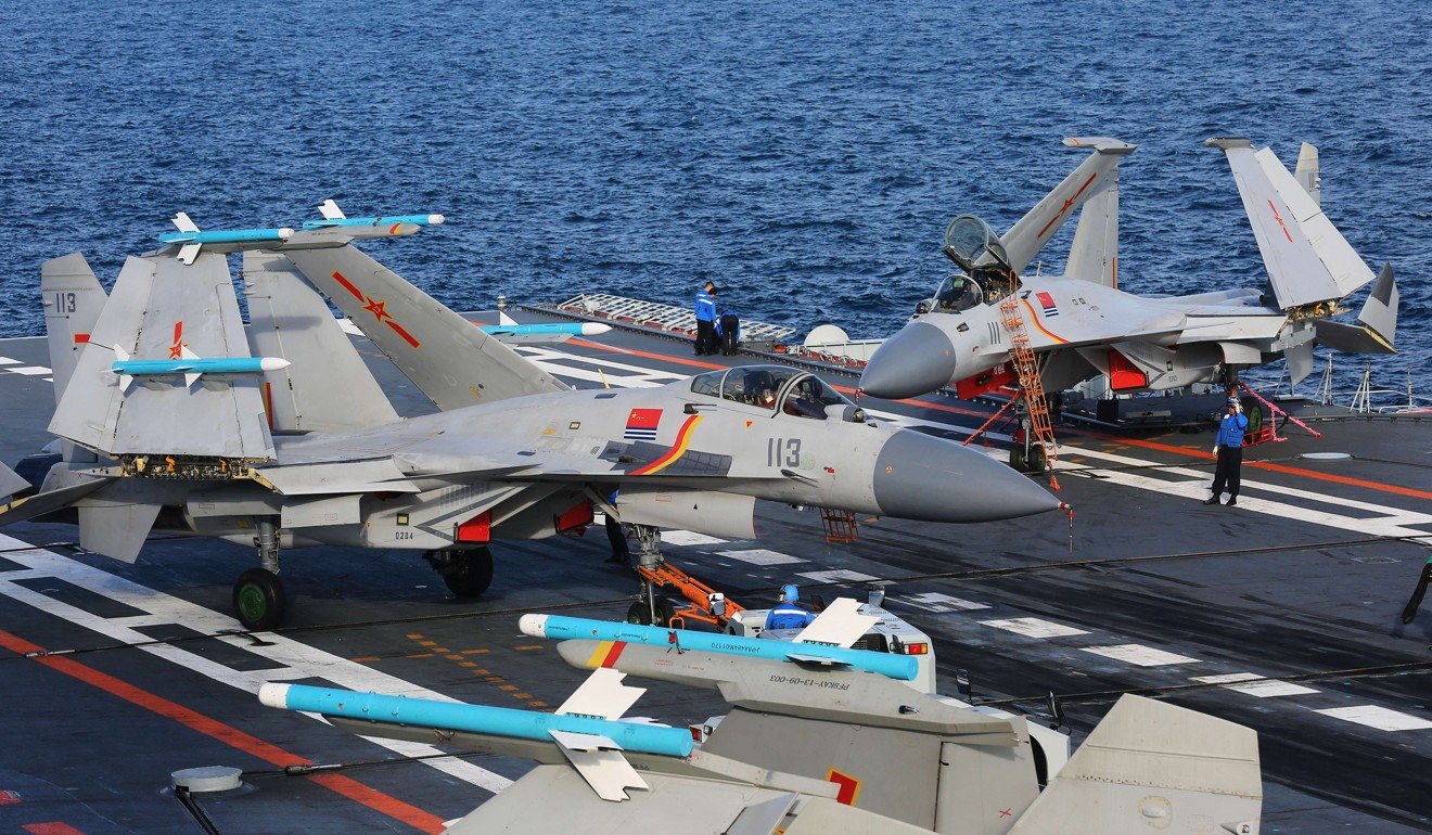 J-15s with folded wings aboard the Liaoning. Photo: Xinhua