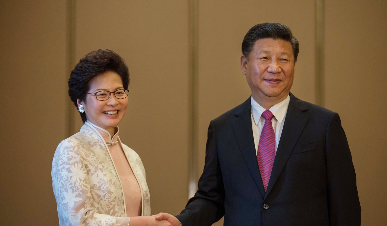 Lam with Chinese President Xi Jinping in Hong Kong on Saturday. Photo: Bloomberg