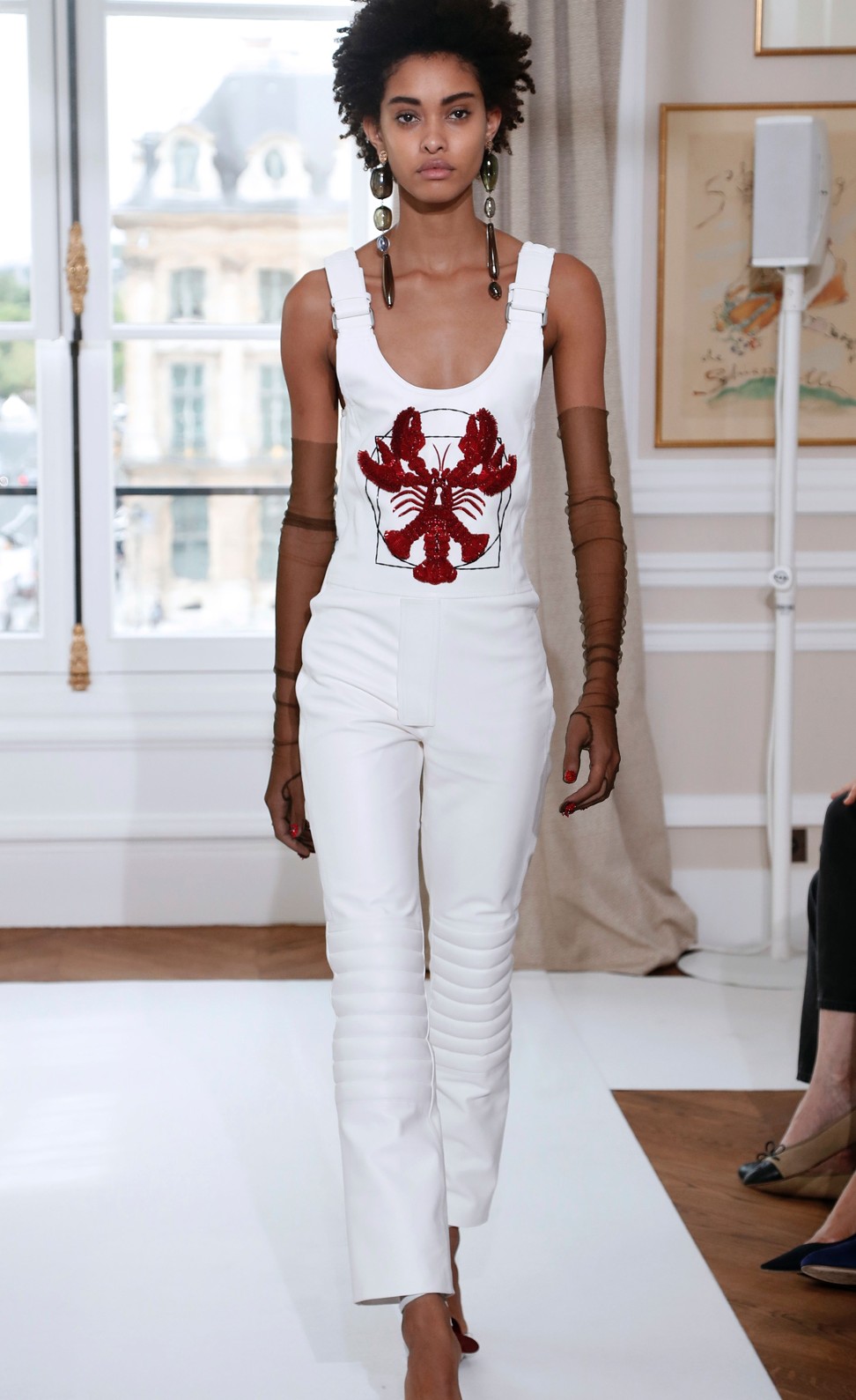 A model wears a beaded lobster motif on a white jumpsuit for Schiaparelli’s 2017 autumn/winter haute couture collection. Photo: AFP