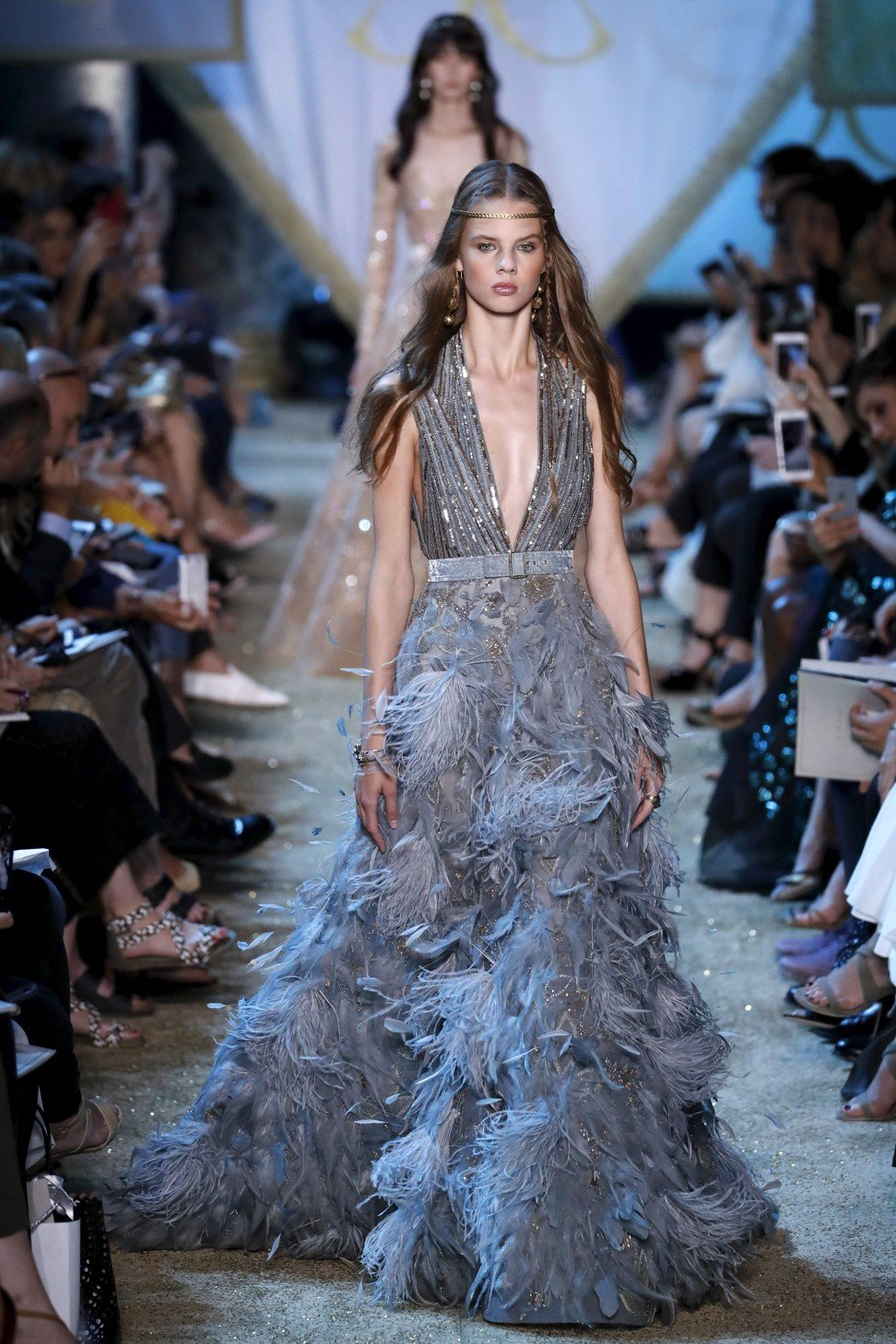 Feathered gowns by Saab. Photo: AFP