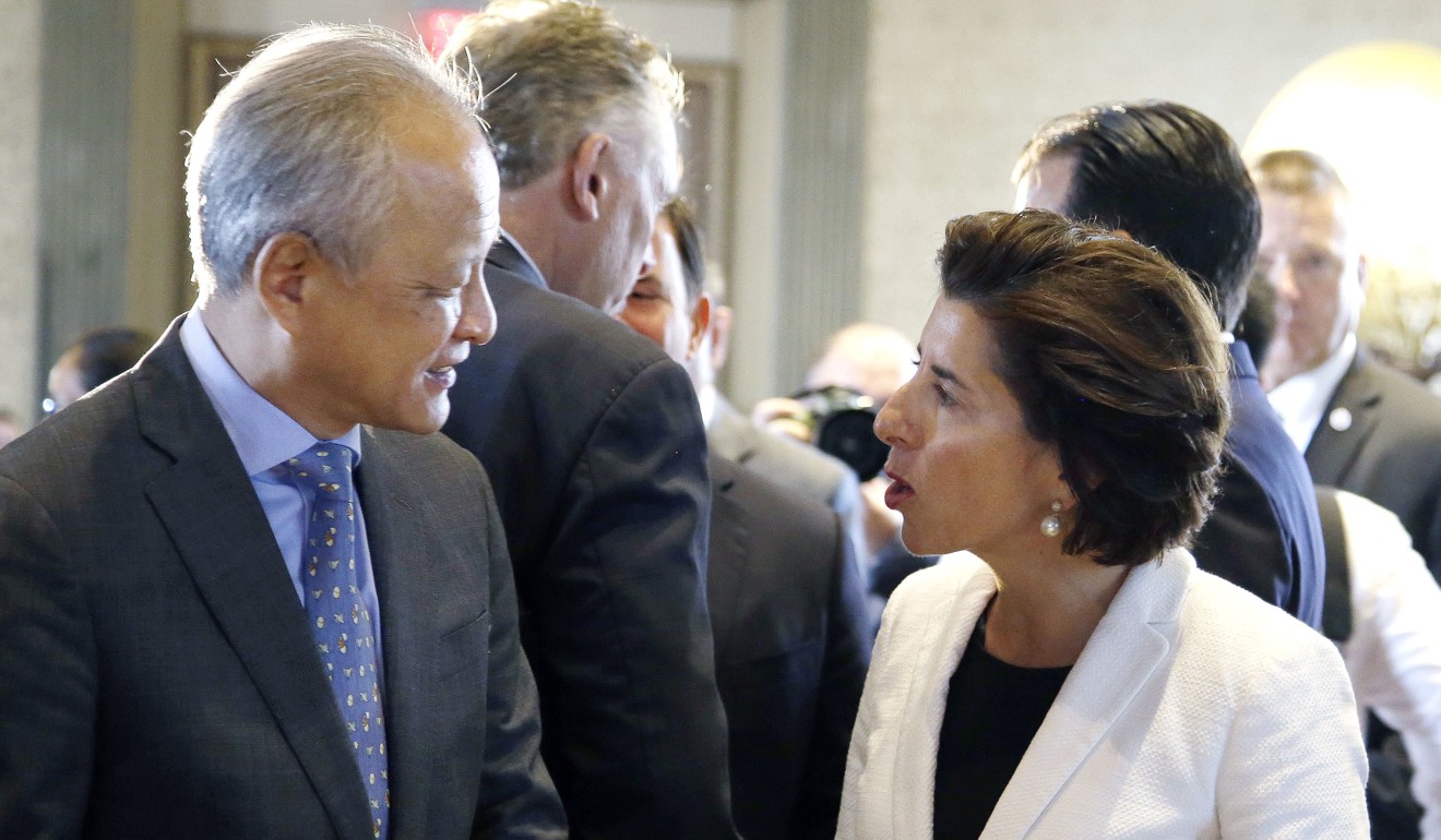 China's Ambassador to the US Cui Tiankai, left, speaks with Rhode Island Governor Gina Raimondo at the China General Chamber of Commerce luncheon on Thursday during the National Governor's Association meeting in Providence, Rhode Island. Photo: Associated Press
