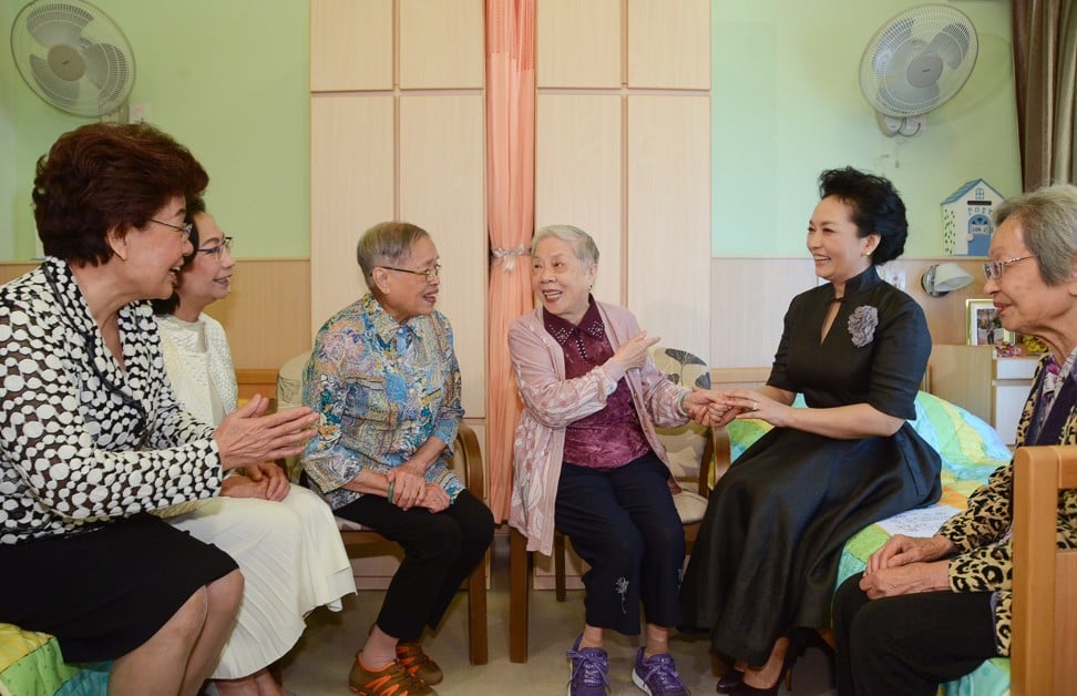 China’s first lady Peng Liyuan, the wife of President Xi Jinping, at an elderly care facility during the couple’s trip to Hong Kong for the 20th anniversary of the city’s handover back to China. Photo / ISD