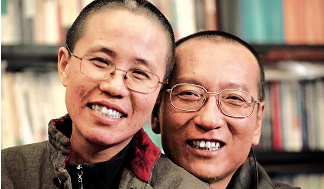 Liu Xiaobo and wife Liu Xia pose in an undated photo released by the family in October 2010. Photo: Reuters