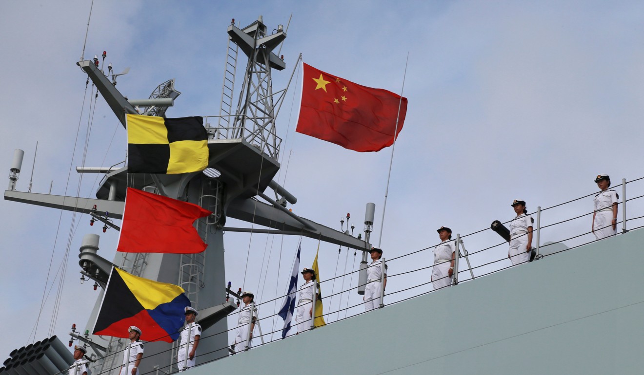 Soldiers of China’s People’s Liberation Army (PLA) stand on a ship sailing off from a military port in Zhanjiang, Guangdong province on Tuesday. Photo: Reuters