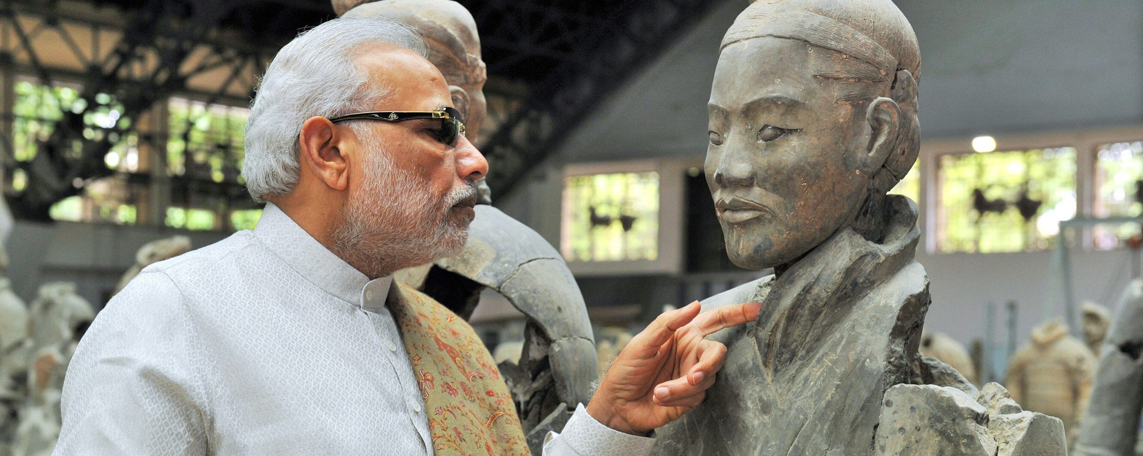 India’s Prime Minister Narendra Modi looking at a terracotta warrior in Xian. Photo: EPA