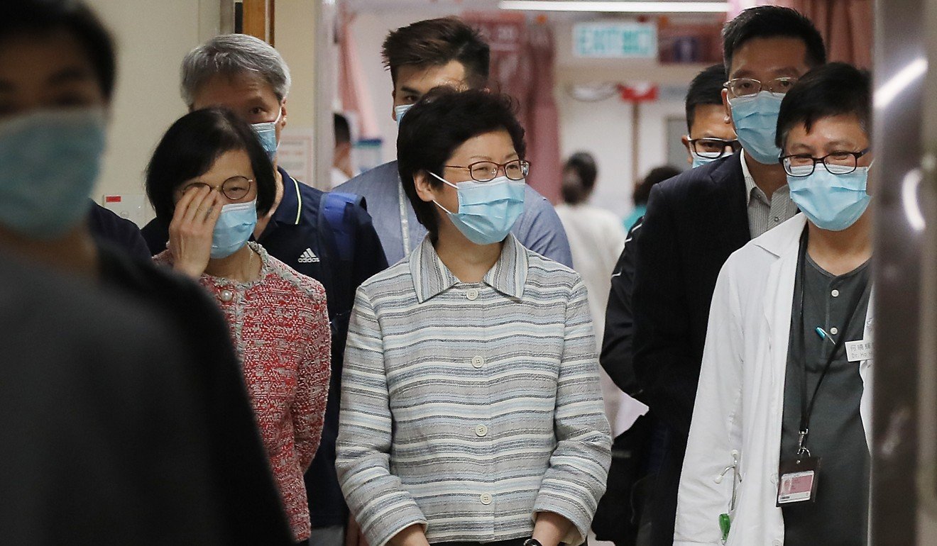 Chief Executive Carrie Lam Cheng Yuet-ngor and the Food and Health secretary, Sophia Chan Siu-chee (left), visit Queen Elizabeth Hospital on July 16, as the city struggles with yet another flu outbreak. Photo: Handout