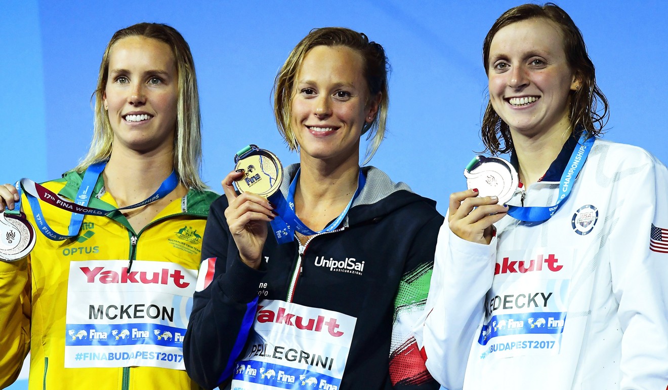 Federica Pellegrini (centre) poses with her gold medal alongside Emma McKeon (left) Katie Ledecky. Photo: EPA