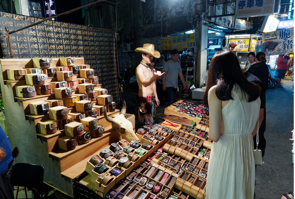 Kenting Street’s shirtless belt seller.