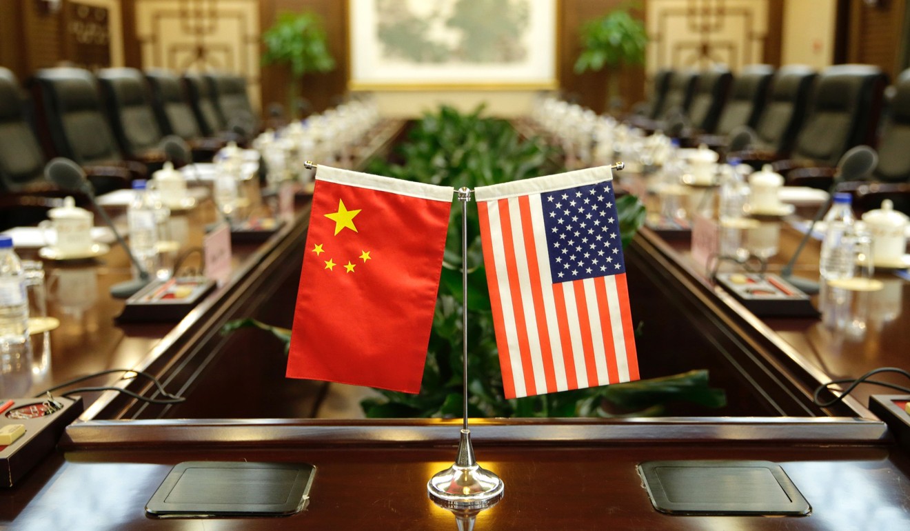 Flags of the US and China are placed ahead of a meeting between US Secretary of Agriculture Sonny Perdue and China's Agriculture Minister Han Changfu, at the Ministry of Agriculture in Beijing in June. Photo” AP