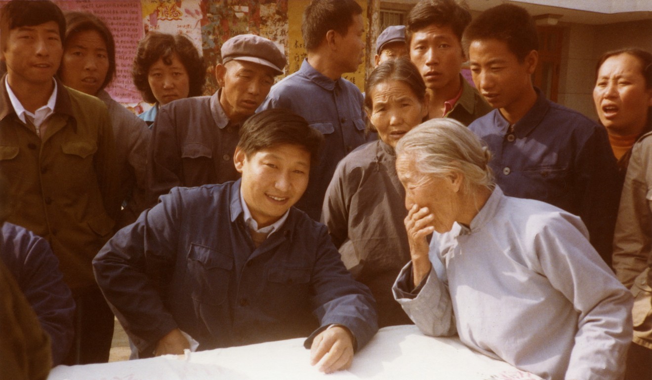 Xi Jinping is shown in 1983 as secretary of the Zhengding County Committee of the Communist Party of China, listening to villagers. Photo: Xinhua