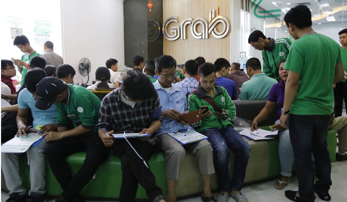 Applicants fill in forms to join Grab Vietnam at the company's office in Hanoi. Photo: AP