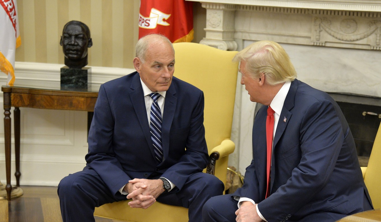 President Donald Trump confers with the new White House Chief of Staff John Kelly. Photo: EPA