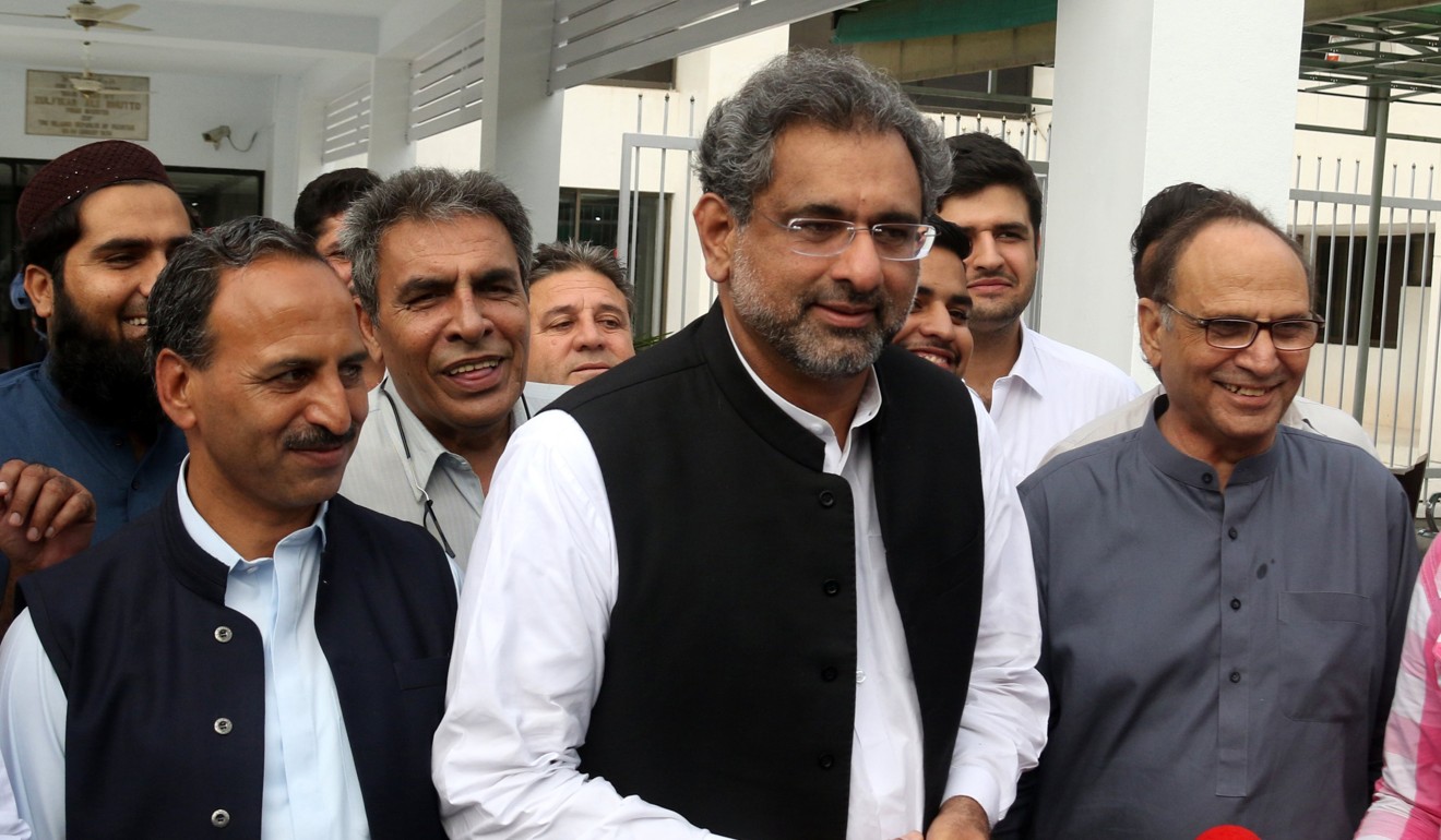 Shahid Khaqan Abbasi (centre), the former petroleum minister. Photo: EPA