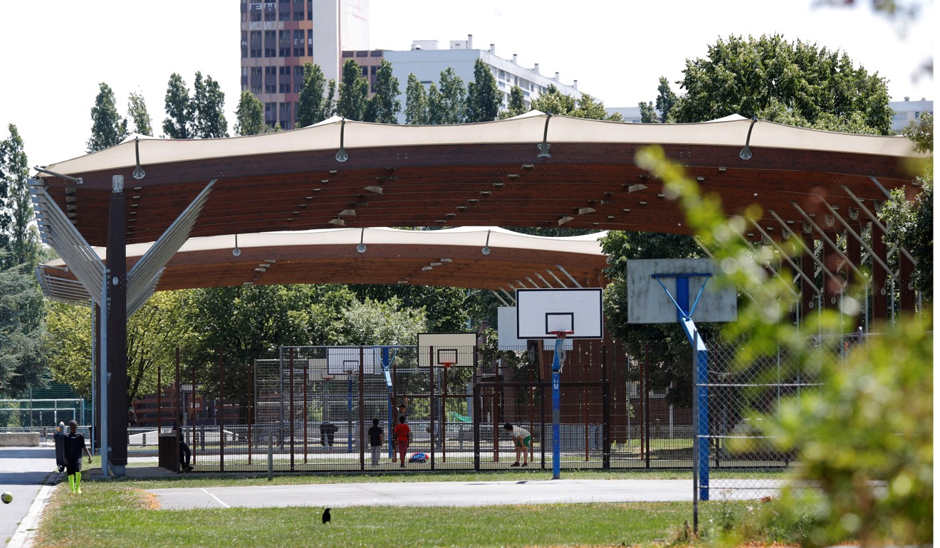 Local youths play basketball at the Marville sports complex, in the Paris suburb of Saint-Denis. The complex will undergo renovation for water polo competitions for the 2024 Olympic and Paralympic Games. Photo: Reuters