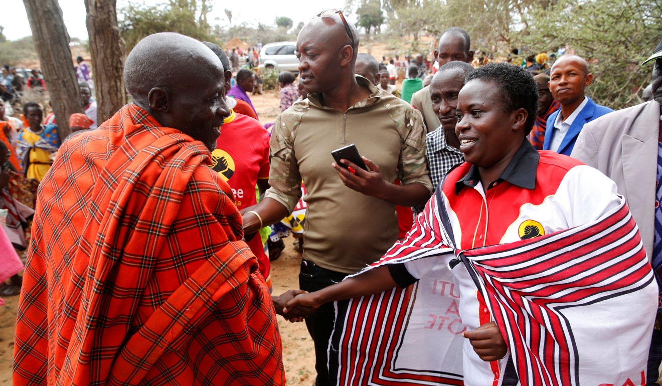 Kenyan lawmaker Sarah Korere greets a supporter. Photo: Reuters
