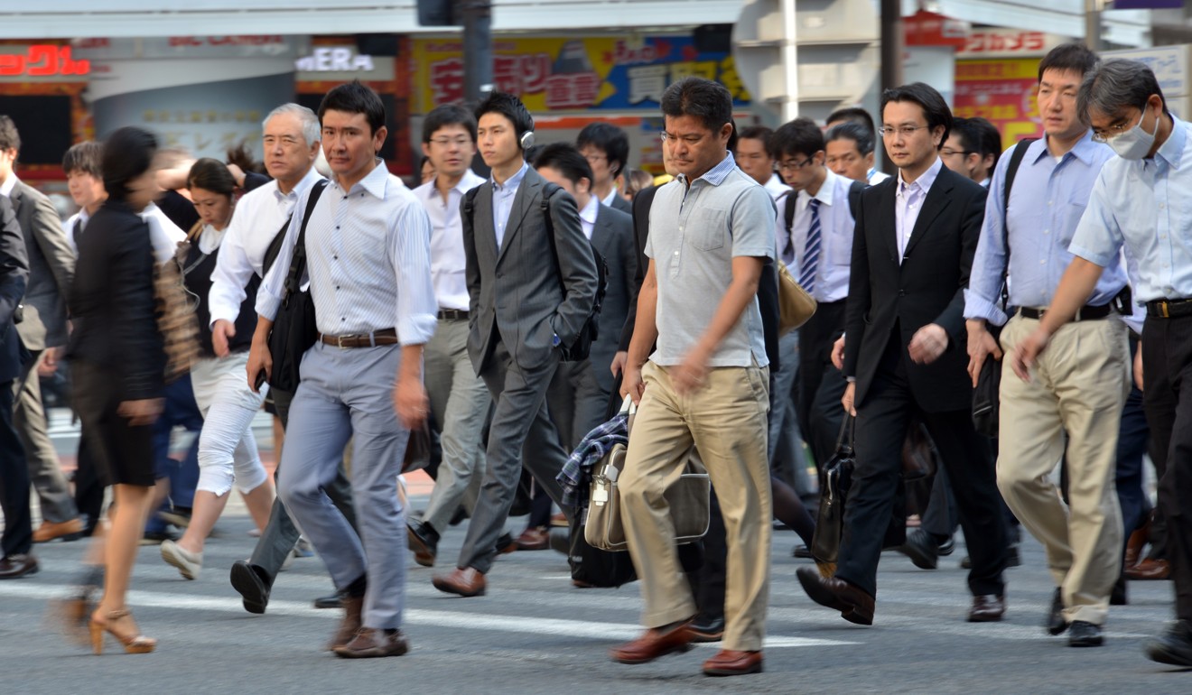 There is a shortage of manual workers, but an excess of white collar workers, especially middle-aged men, according to Naohiro Yashiro. Photo: AFP