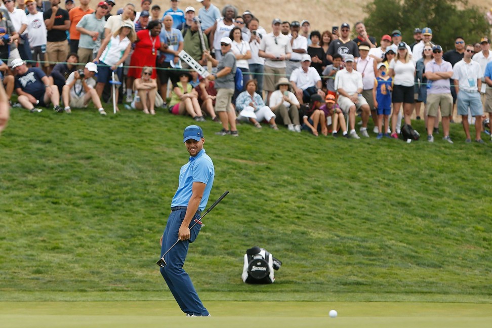 Curry reacts as he misses a putt on the seventeenth green. Photo: AFP