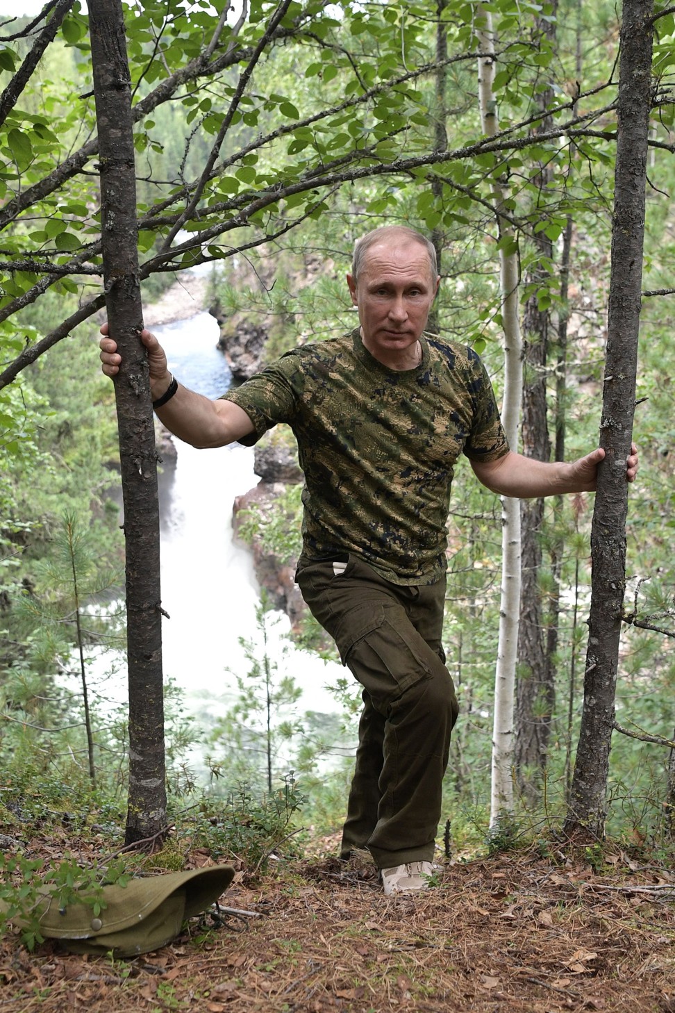 Putin during a walking trip in the mountains. Photo: EPA