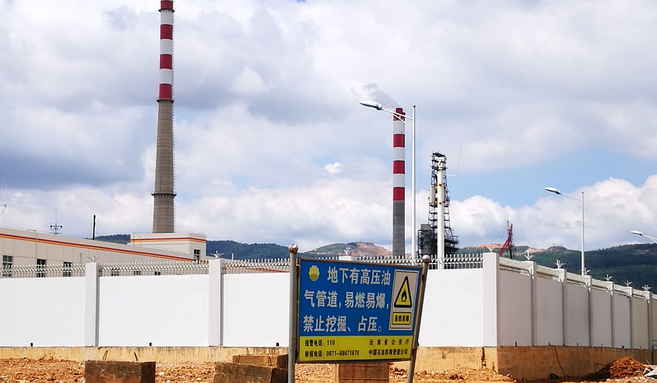 A sign outside the new refinery reads ‘high-pressure pipeline underground, no digging’. Photo: He Huifeng