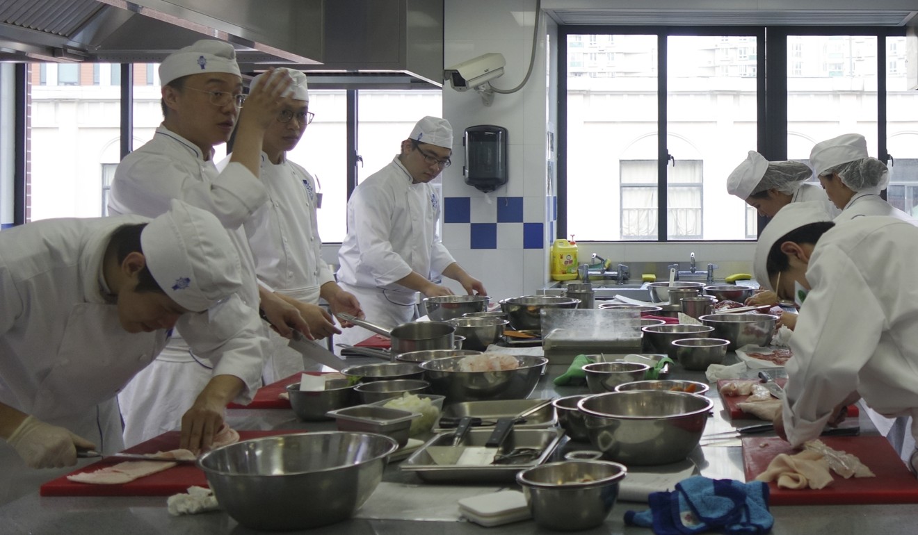 Hard at work in the kitchen of the Shanghai campus. Photo: Juli Min