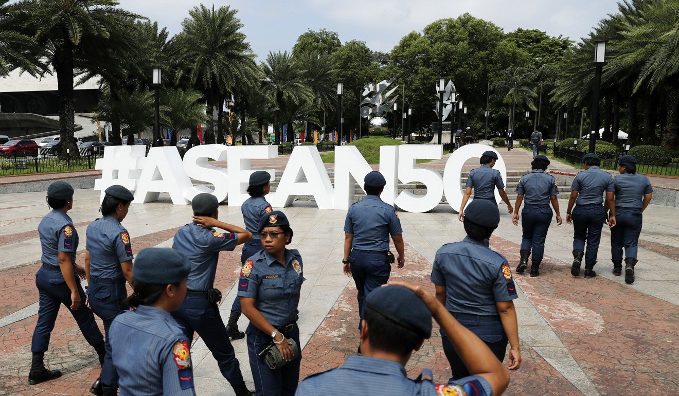 Policemen patrol near the venue of the Asean meeting in Manila. Photo: EPA