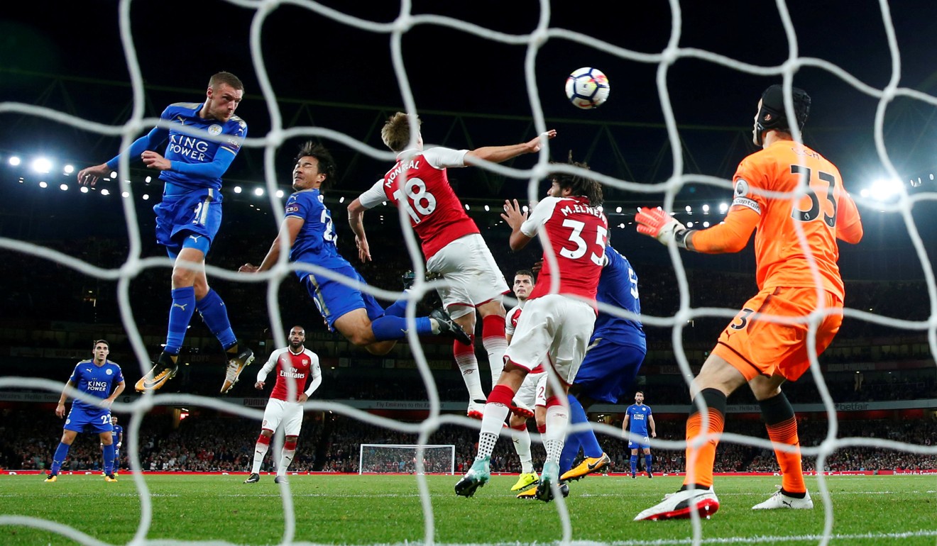 Leicester City's Jamie Vardy scores their third goal against Arsenal.