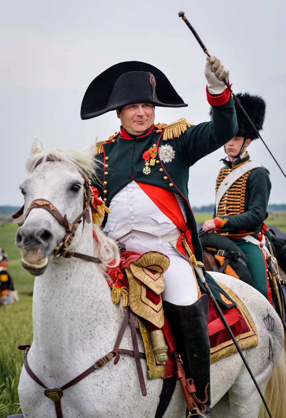 “Napoleon” salutes during a re-enactment of the Battle of Waterloo in Belgium in June 2015, as part of the bicentennial celebrations of the battle. Napoleon’s final defeat was the result of a fatal hesitation by Marshal Grouchy, who stuck to his orders to pursue the Prussian III Corps instead of riding to Waterloo when loud cannon fire heralded the battle’s decisive moment. Photo: EPA