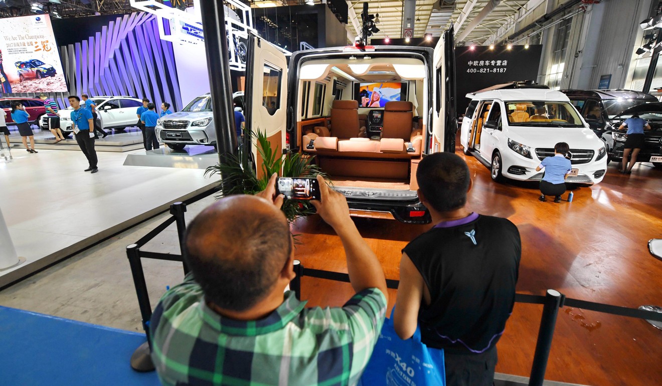 A visitor takes photos of a recreational vehicle at the 14th Changchun International Automobile Expo on July 22. With the growing popularity of self-driving travel, RVs are becoming more popular among Chinese consumers. Photo: Xinhua