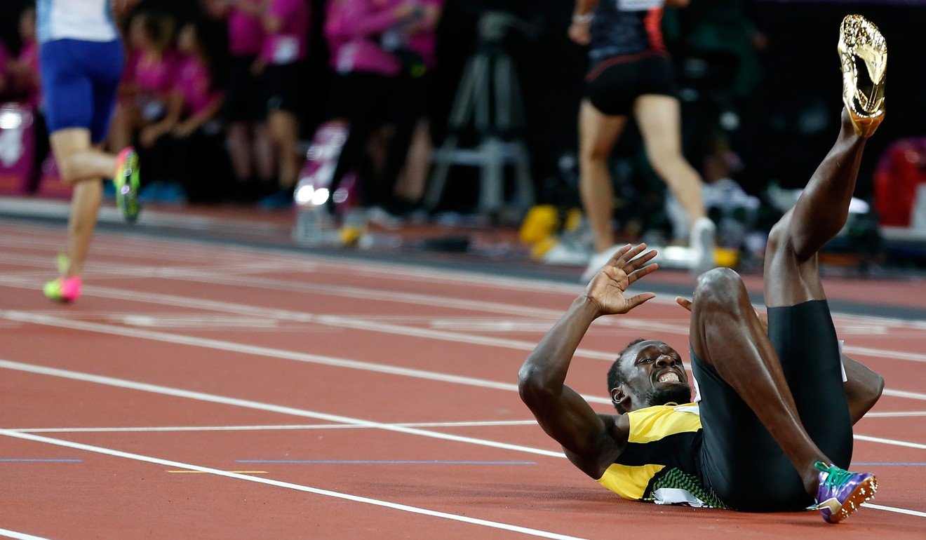 Usain Bolt tumbled during the anchor leg of the race. Photo: Xinhua