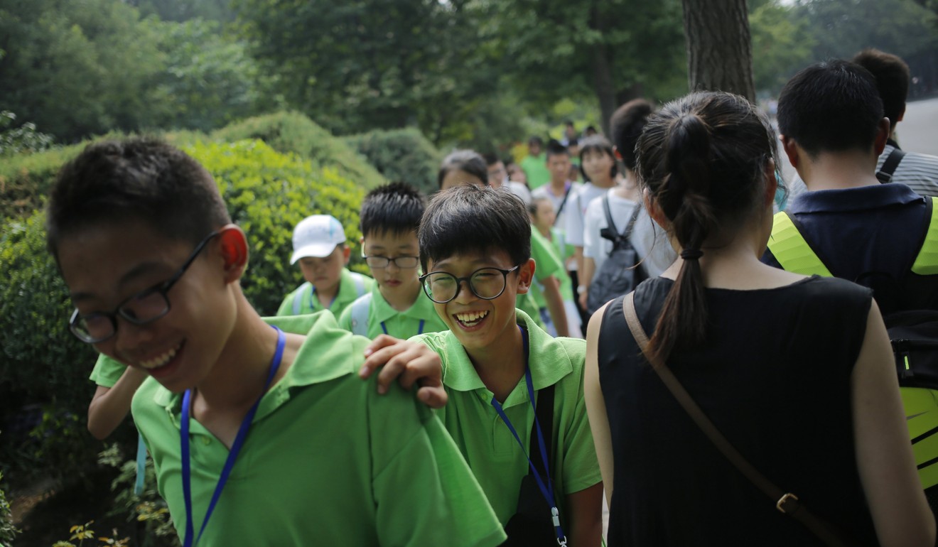 Children visit Tsinghua University in Beijing this summer. Photo: EPA