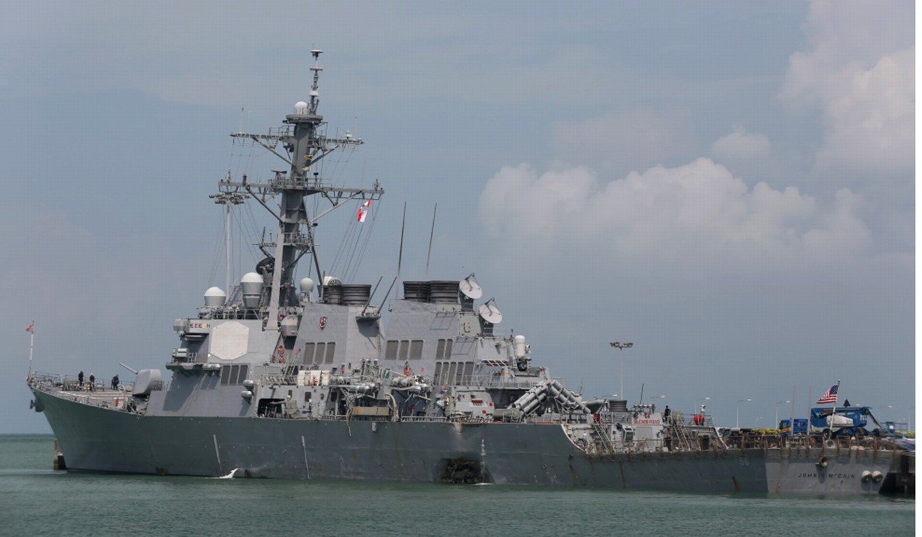 The Guided-missile destroyer USS John S. McCain is moored pier side at Changi naval base in Singapore on Monday. Photo: AP
