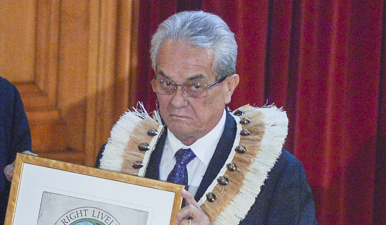 Tony de Brum, Foreign Minister of the Marshall Islands, receives an honorary award on behalf of the people of the Marshall Islands for their struggle against all nine nuclear weapons states for their failure to abide by the provisions of the Nuclear Non-Proliferation Treaty from Jakob von Uexkull, the founder of the award. Photo: AP