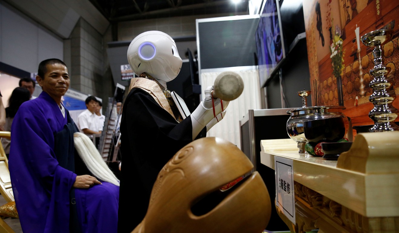 A ‘robot priest’ wearing a Buddhist robe standing in front of a funeral altar at the Life Ending Industry EXPO 2017 in Tokyo, Japan, August 23, 2017. Photo: Reuters