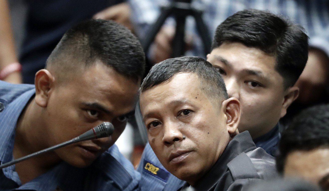 From left: Jeremiah Pereda, Arnel Oares, and Jerwin Cruz, who conducted an anti-drug operation that resulted in the killing of Delos Santo. Photo: EPA