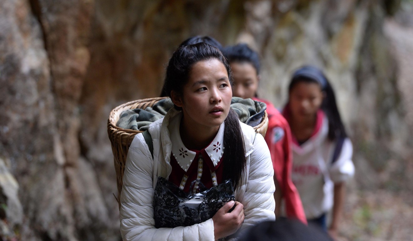 Girls walking to school in Mukeji in a remote area of Yunnan province. Photo: Xinhua