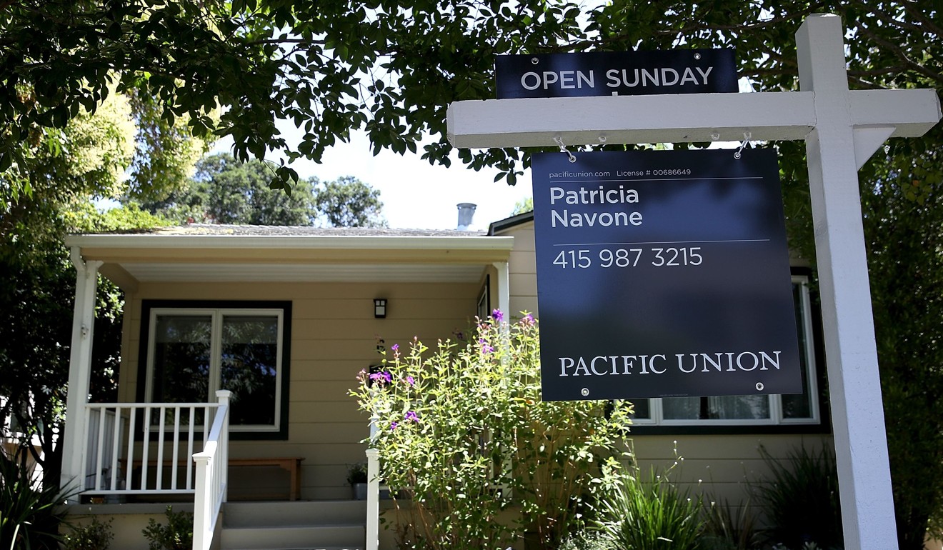 A sign is posted in front of a home for sale in San Anselmo, California. Financial reforms have protected the US economy. Photo: AFP