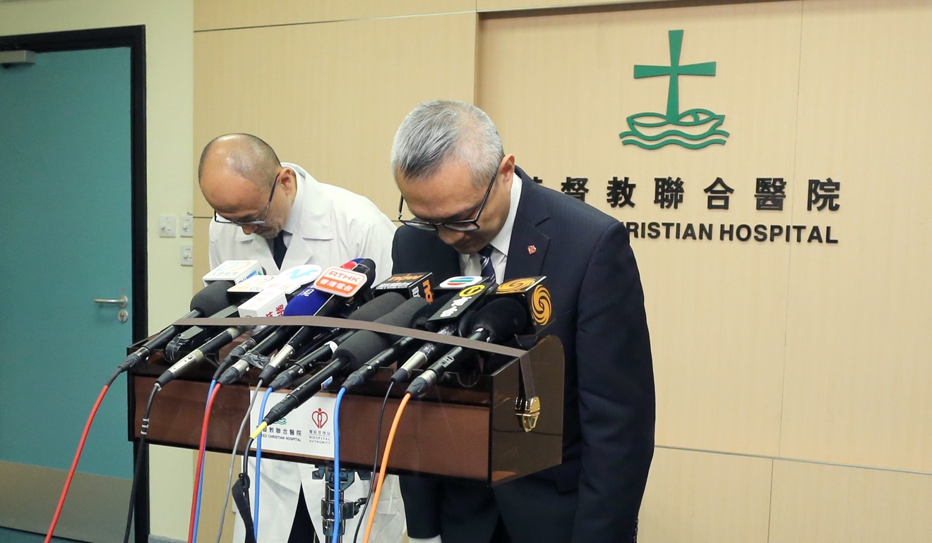 United Christian Hospital CEO Dr Chui Tak-yi (right) and Dr Kung Kam-ngai, chief of service in the department of medicine and geriatrics, bow in apology. Photo: Dickson Lee