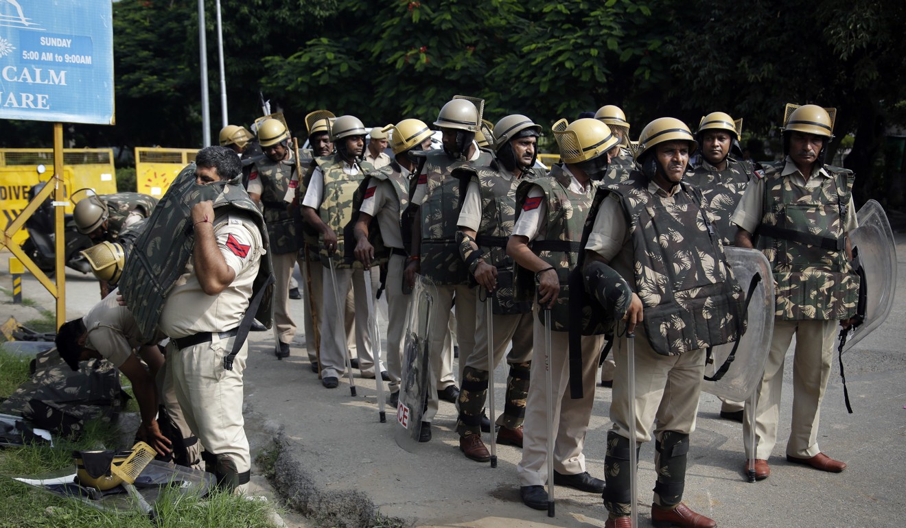 Indian policemen are standing by. Photo: AP