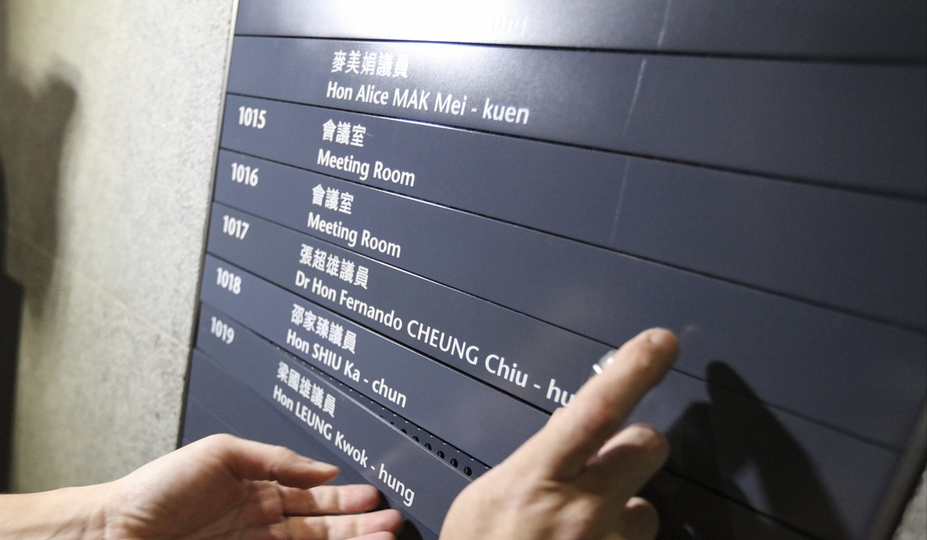 Name tags are removed after lawmakers, Nathan Law Kwun-chung; Leung Kwok-hung; Lau Siu-lai; and Edward Yiu Chung-yim were disqualified at the High Court in Admiralty. Photo: Felix Wong