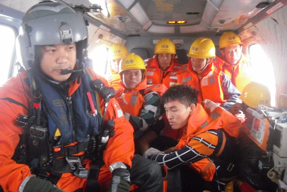 A helicopter takes sailors rescued from the Hong Tai 176 to safety. Photo: Handout