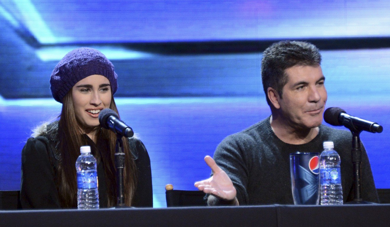 Jauregui and Simon Cowell at The X Factor season finale news conference in 2012. Photo: AFP