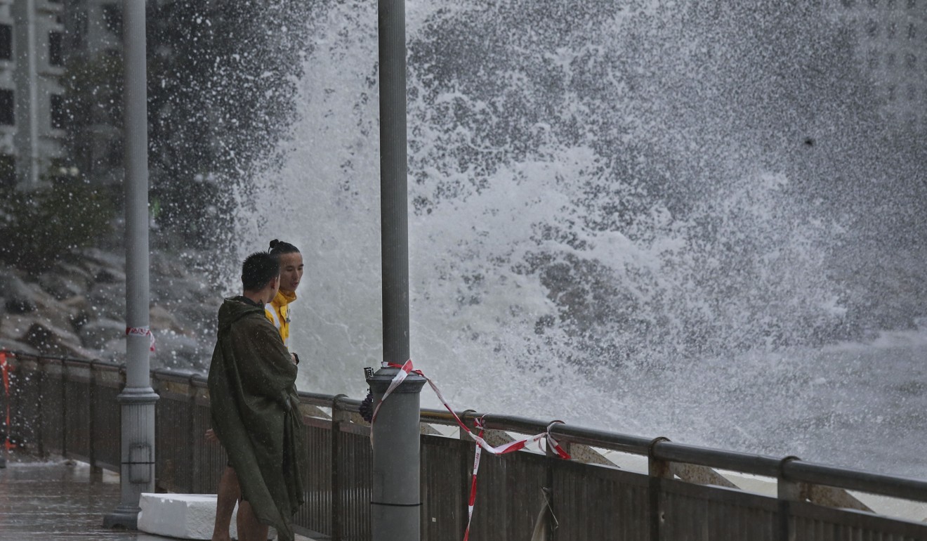 People watch waves pounding the coast at Heng Fa Chuen as Typhoon Pakhar hits Hong Kong on August 27. Photo: Dickson Lee