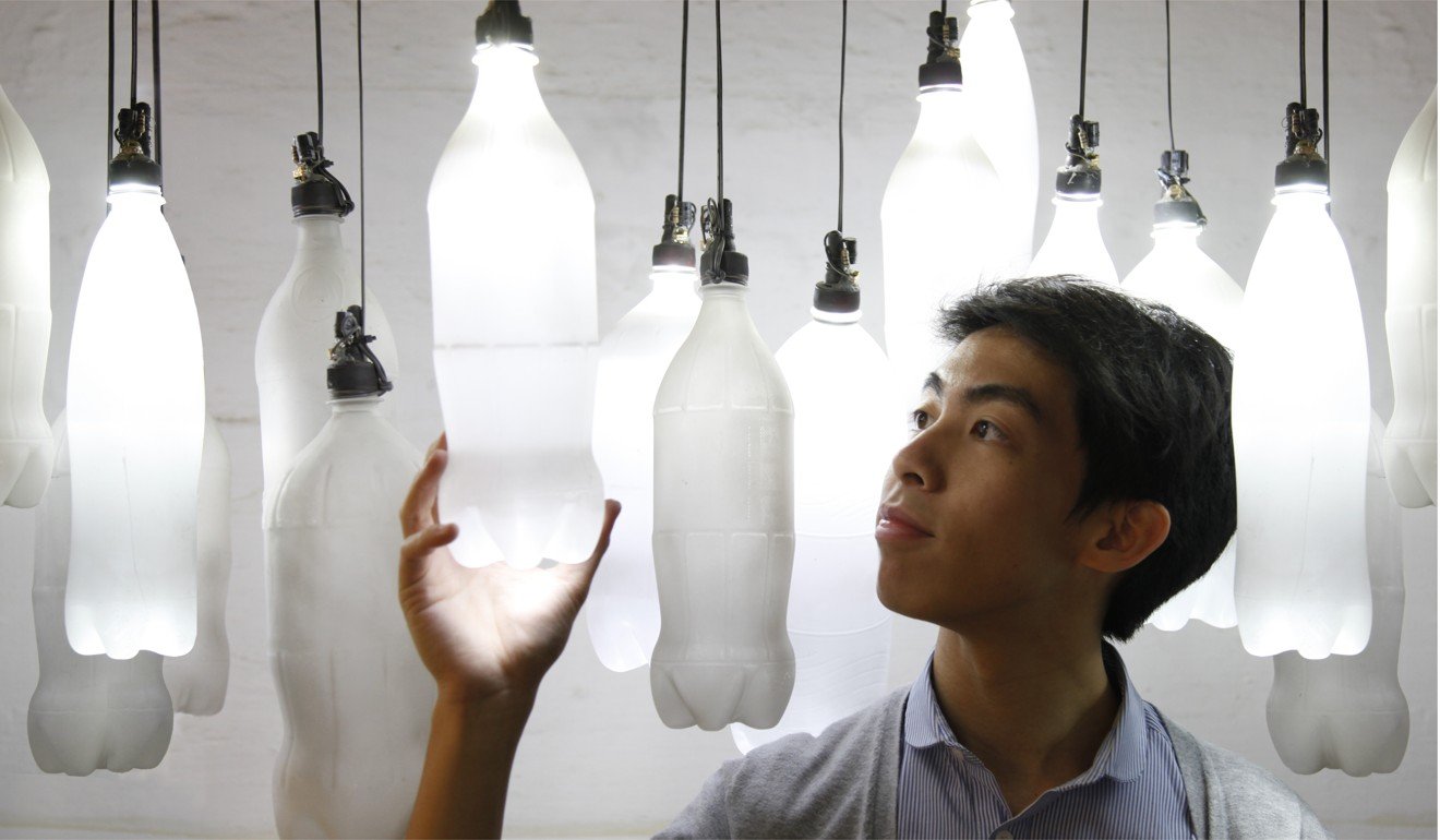 Cheung with his installation Bottle Chime, made up of waste PET bottles that are pressurised with air to create a glass-like sound when bumping into each other. Photo: Kevin Cheung