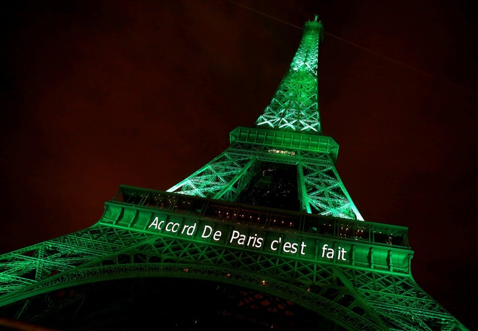 The Eiffel Tower is illuminated in green and displays the words for “Paris Agreement is Done”, to celebrate the UN Climate Change agreement, in Paris last November 4. Photo: Reuters