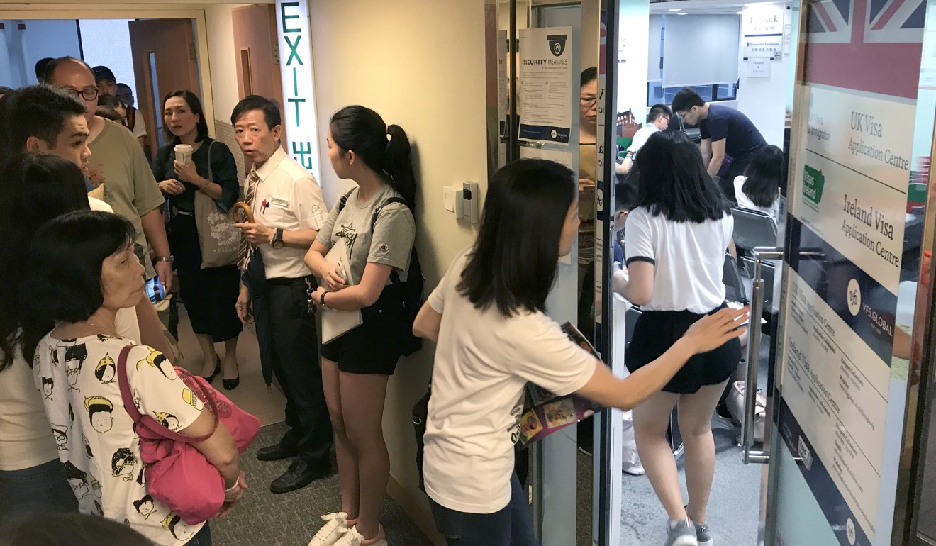 Students wait at the UK Visa Application Centre in Causeway Bay, on September 4. Nora Tam