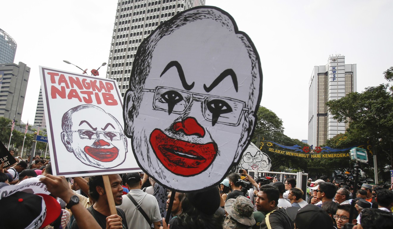 Student activists in Kuala Lumpur call for the resignation of ‘Malaysian Official 1’ – widely thought to be Najib Razak. Photo: AP