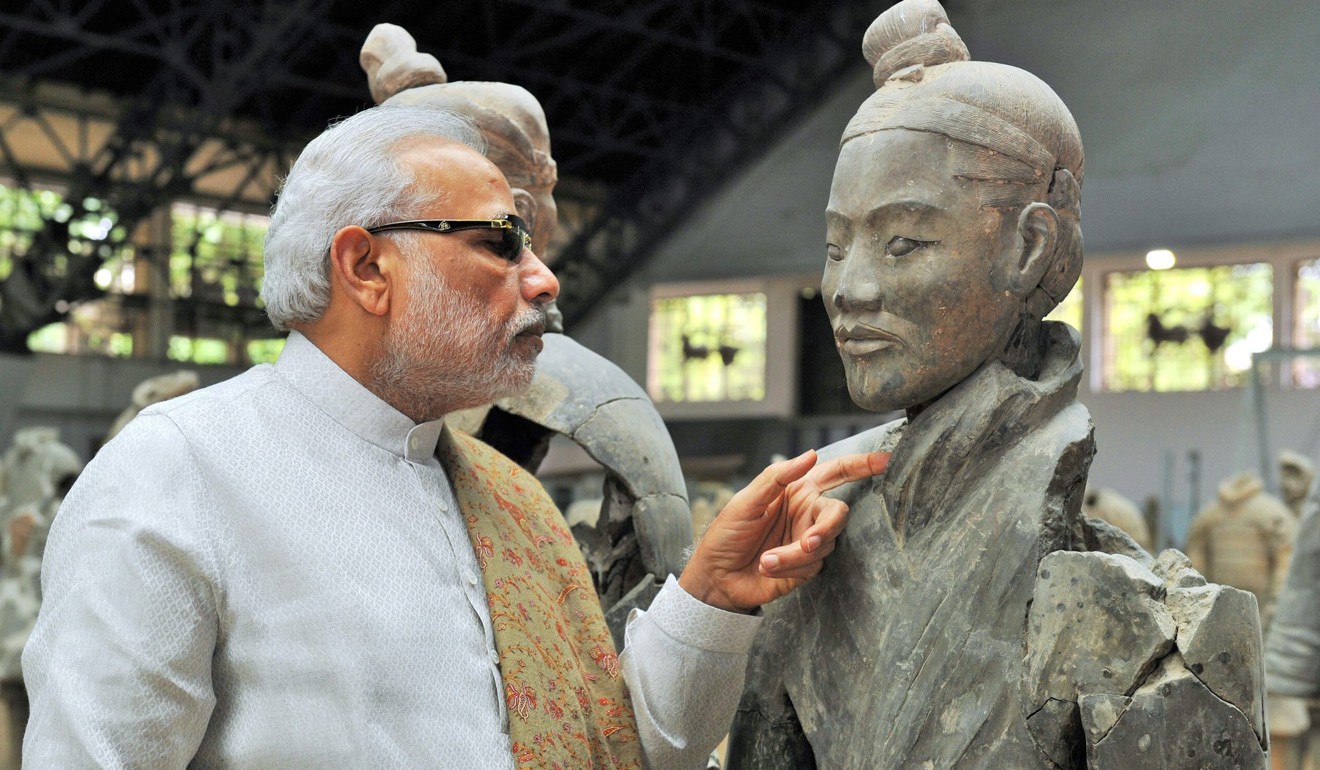 Indian Prime Minister Narendra Modi takes a closer look at a terracotta warrior during a trip to Xian in May 2015, as part of a three-day state visit. Photo: EPA/Indian Press Information Bureau