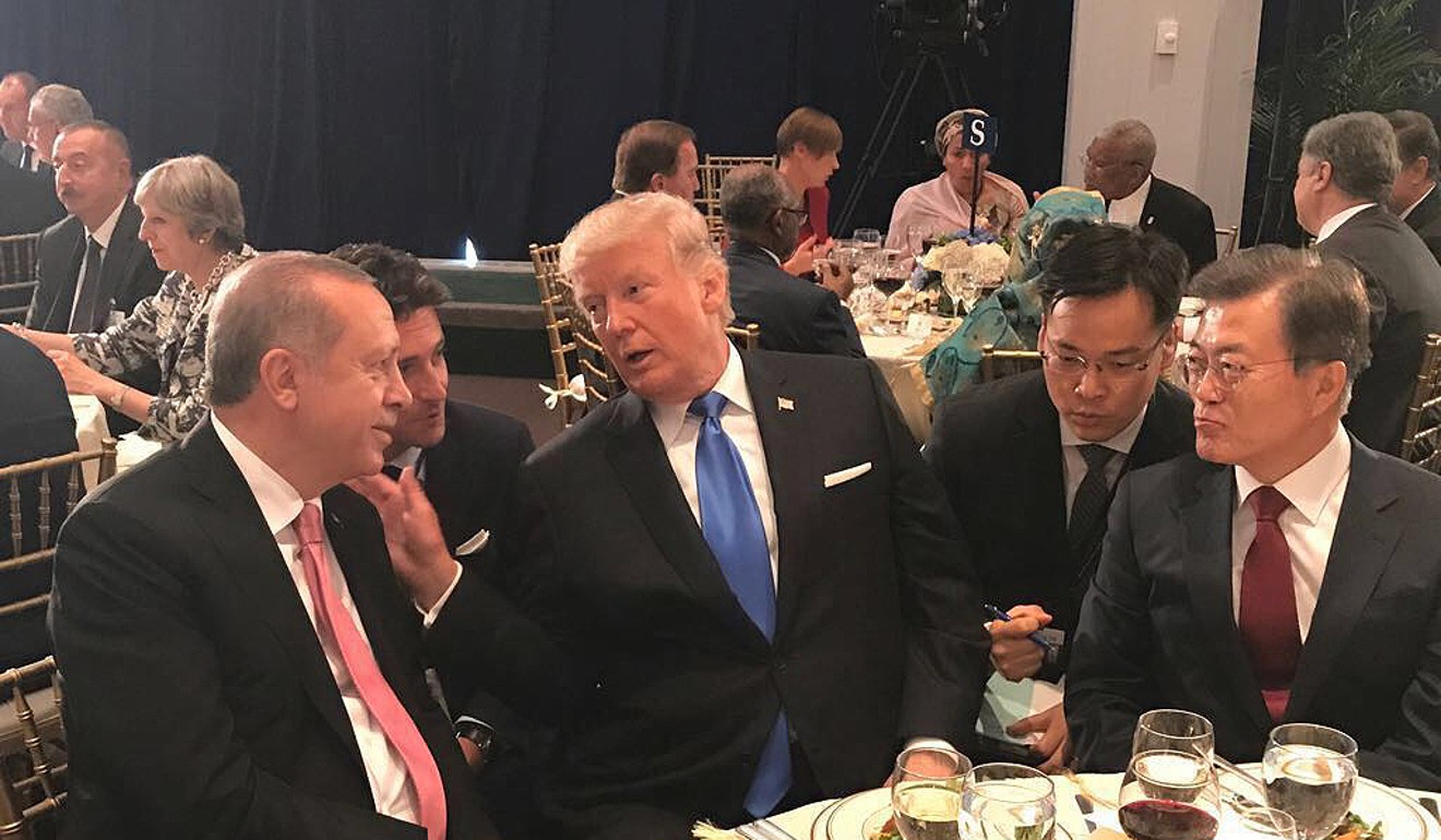 Turkey's President Recep Tayyip Erdogan listens to US President Donald Trump during a dinner at UN headquarters with South Korean President Moon Jae-in sitting to Trump’s left. Photo: AP