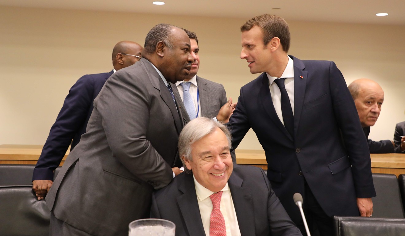 Antonio Guterres (centre), Secretary-General of the United Nations, chuckles as the President of Gabon, Ali Bongo Ondimba (left), and French President Emmanuel Macron greet each other at the United Nations headquarters on Tuesday. Photo: AFP