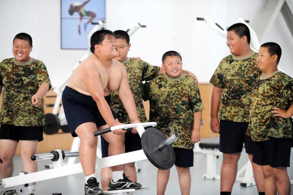 Overweight children attend a “fat camp” at a military training base in northeastern China in this file photograph. A recent study says the problem of obesity among young Chinese is growing fast. Photo: Imaginechina/Corbis